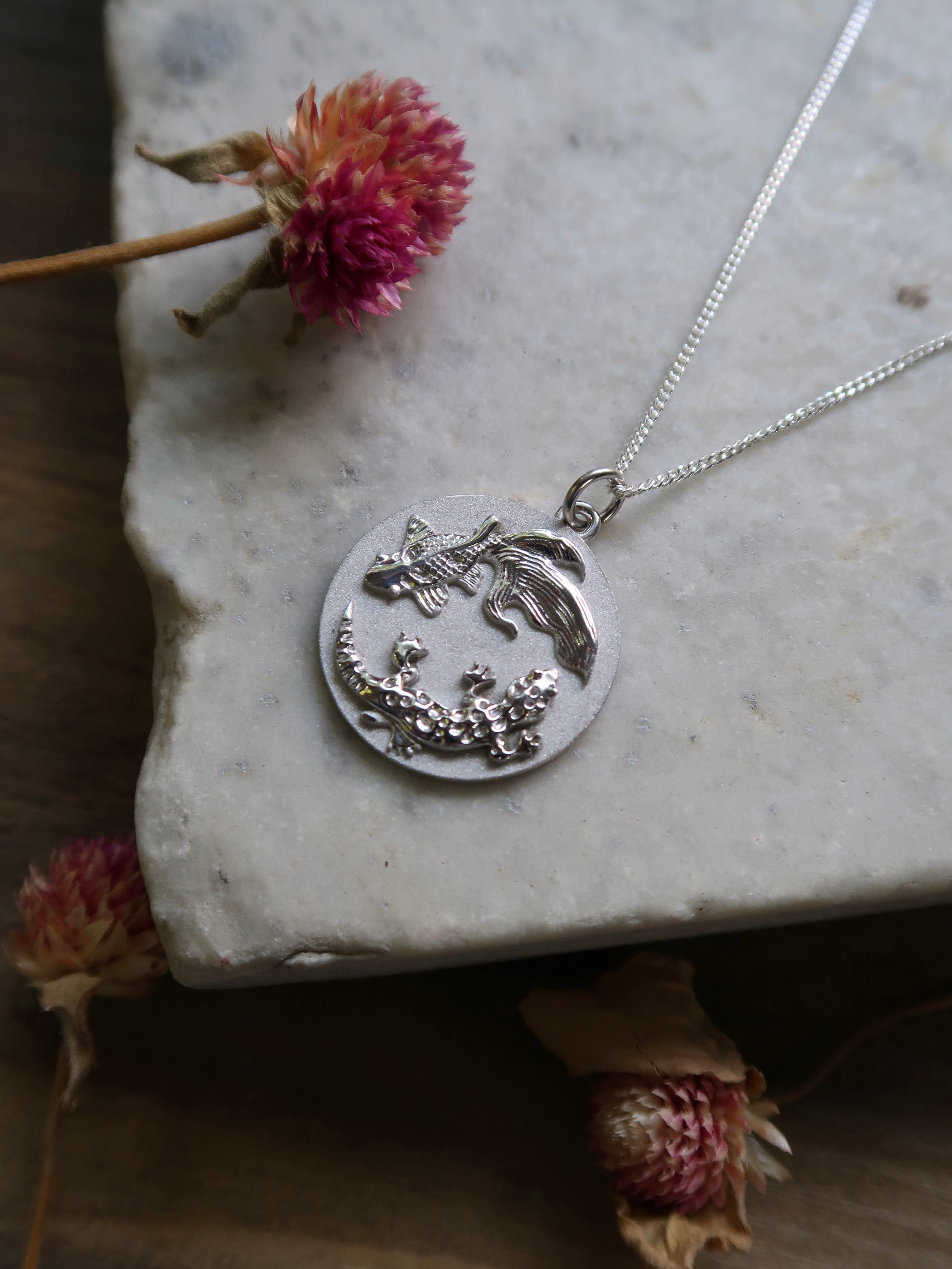 A truly bespoke, one-of-a-kind, white gold engagement pendant. The piece features my client’s two pets, Leon the leopard gecko and Skippy the fantailed goldfish, in a yin yang design!