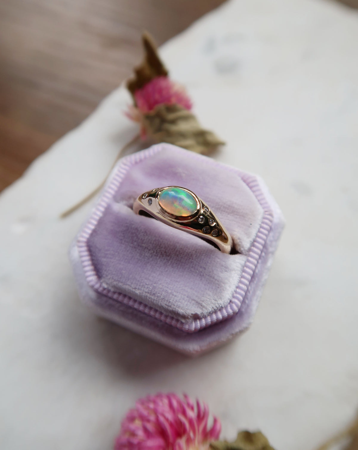 Custom 10k yellow gold, opal and diamond memorial ring. We set the ashes of my client’s late dog under the centre stone, accented with a scattering of flush-set diamonds on the band to add to the celestial and otherworldly energy of the ring.