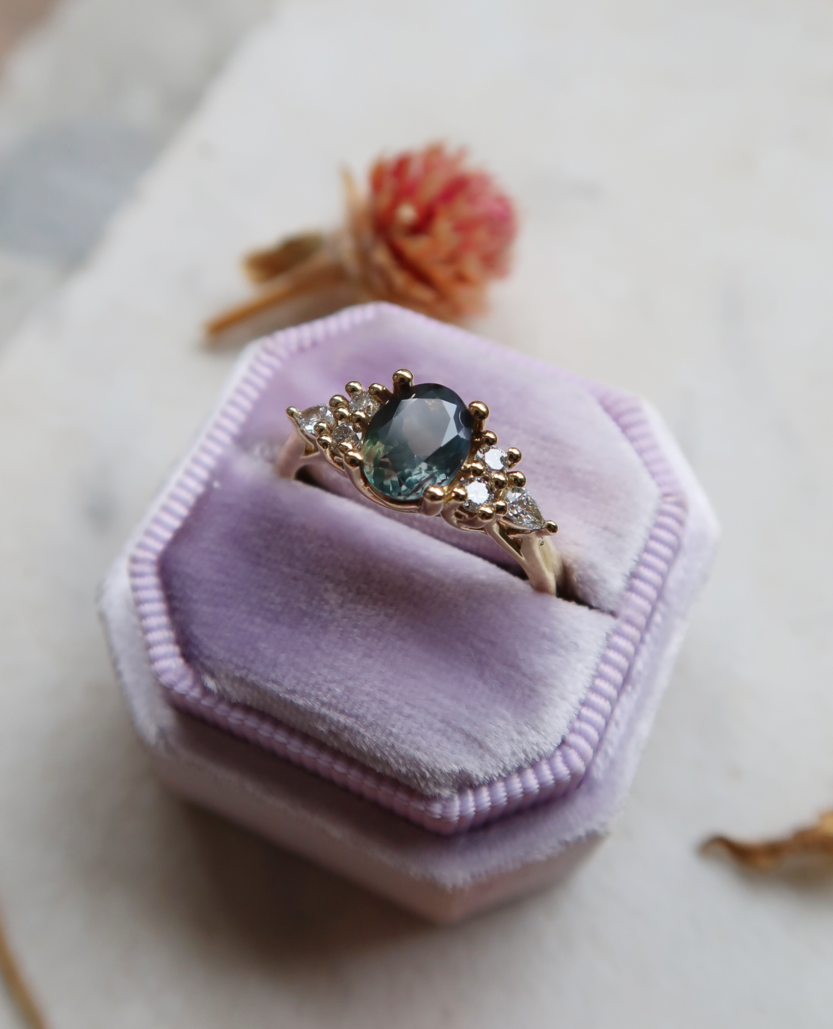 A mesmerizing natural alexandrite framed by delicate diamond accents. This custom version of the Isla engagement ring features an intricate trellis setting, cast in delicious 18k yellow gold.