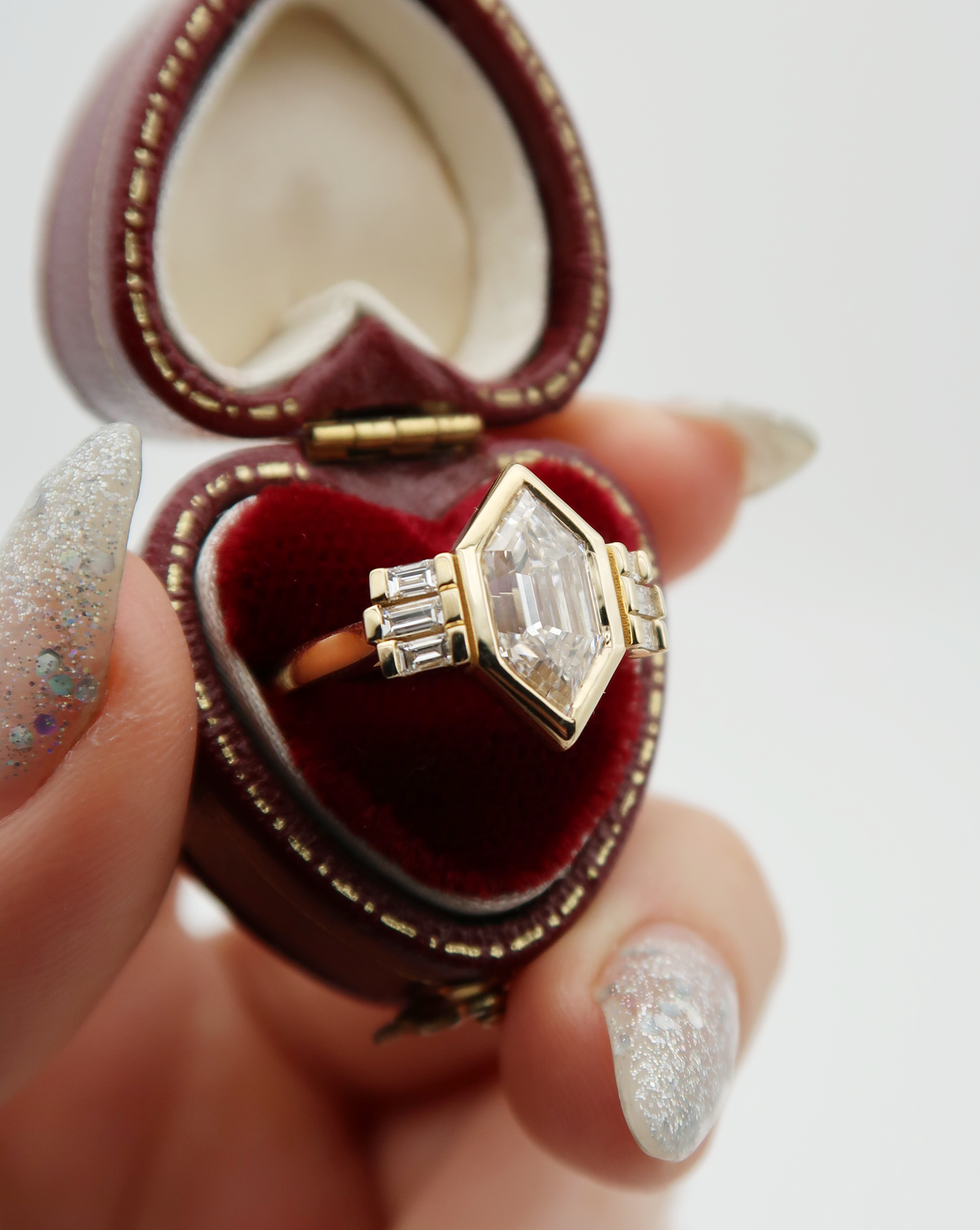 A custom cut Dutch Marquise lab diamond sits at the heart of this architectural engagement ring. Inspired by art-deco jewelry and gothic cathedrals, this bespoke ring is a true showstopper!