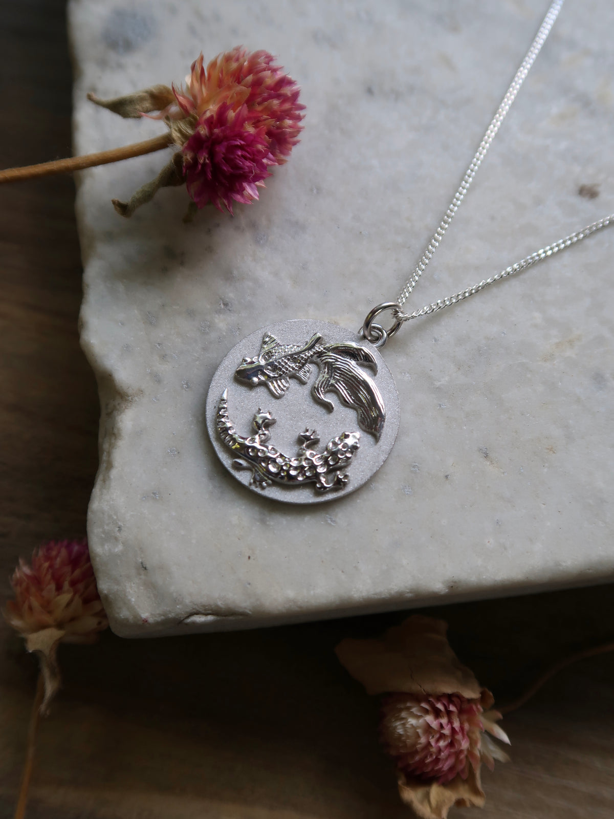 A truly bespoke, one-of-a-kind, white gold engagement pendant. The piece features my client’s two pets, Leon the leopard gecko and Skippy the fantailed goldfish, in a yin yang design!