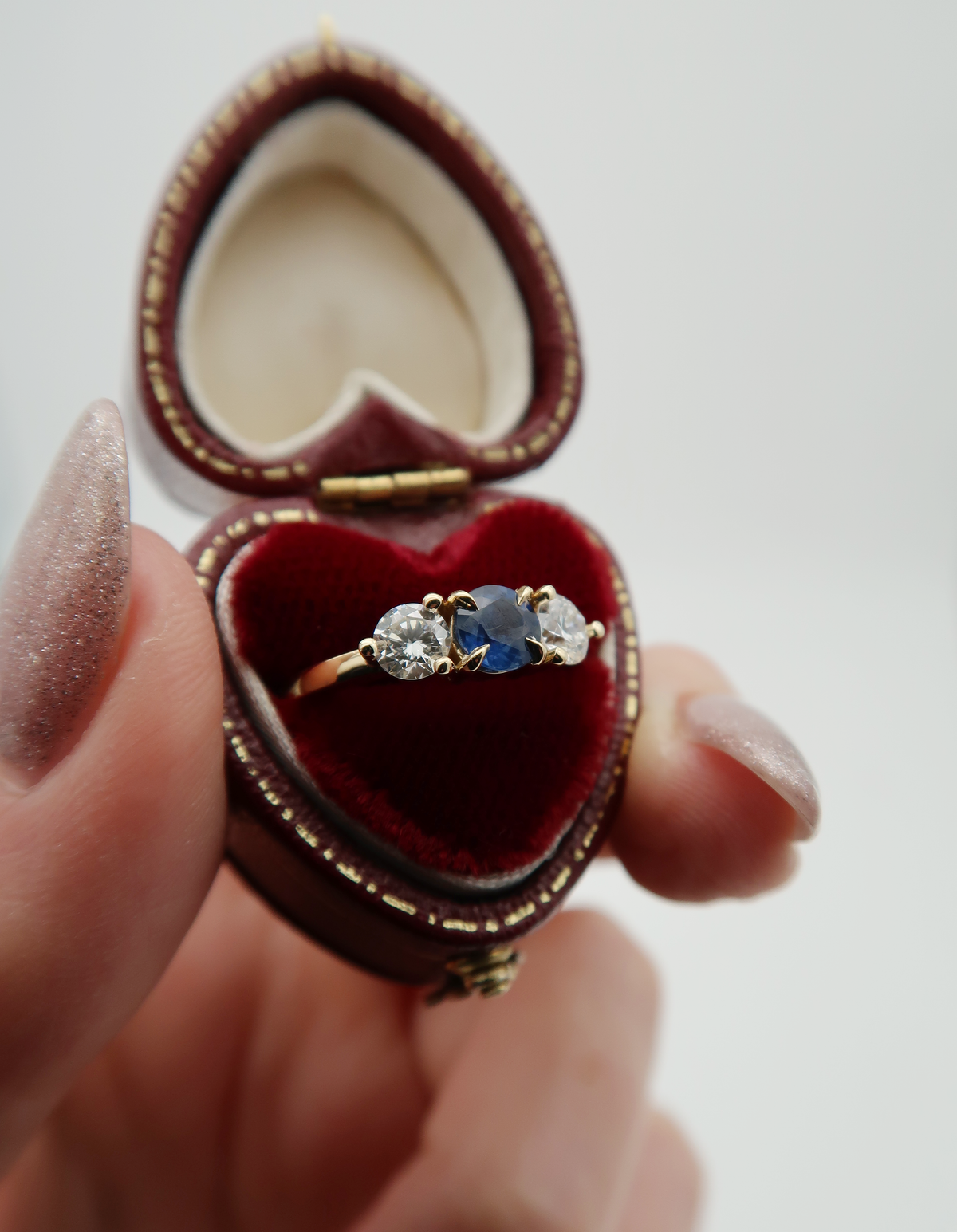 A sweet and sentimental, custom 14k yellow gold memorial ring featuring an heirloom sapphire and diamonds. We set my client’s late mother’s gemstones into a lovely, low profile, three-stone setting, allowing my client to easily wear the piece daily, and keep their mother’s memory close. 